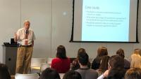 A faculty member giving a lecture to students